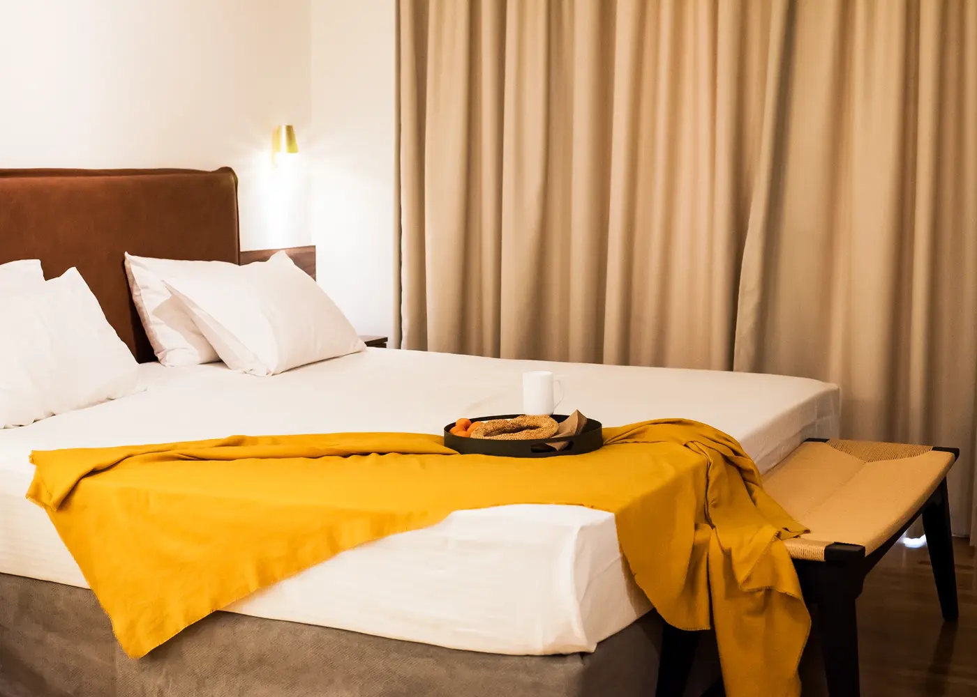 Deluxe Room at Gaia Athens featuring natural light and stylish minimalist design